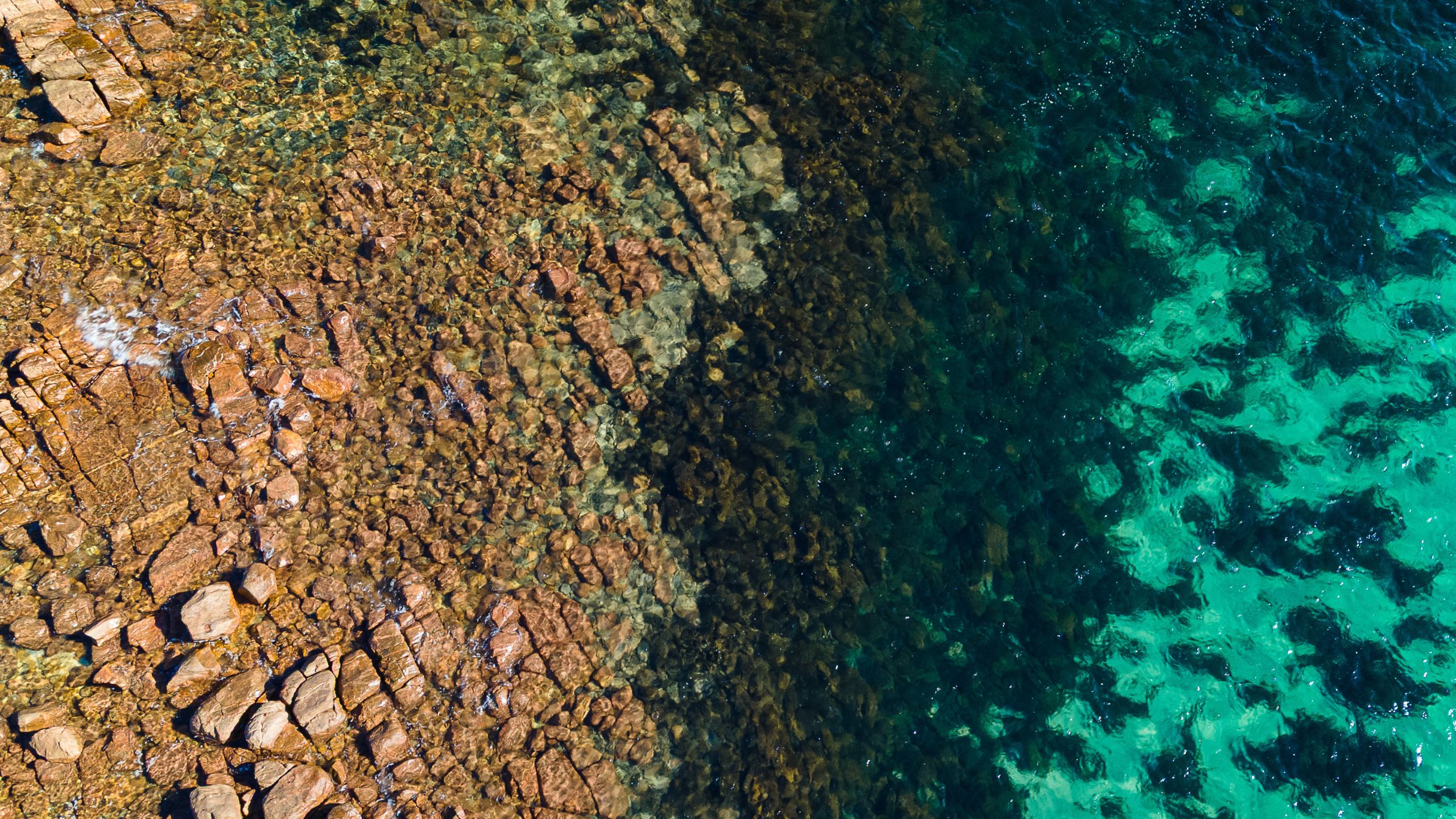 Drone image of The Granites, South Australia’s Eyre Peninsula, with striking granite outcrops, turquoise water, and wave-washed rock platforms.