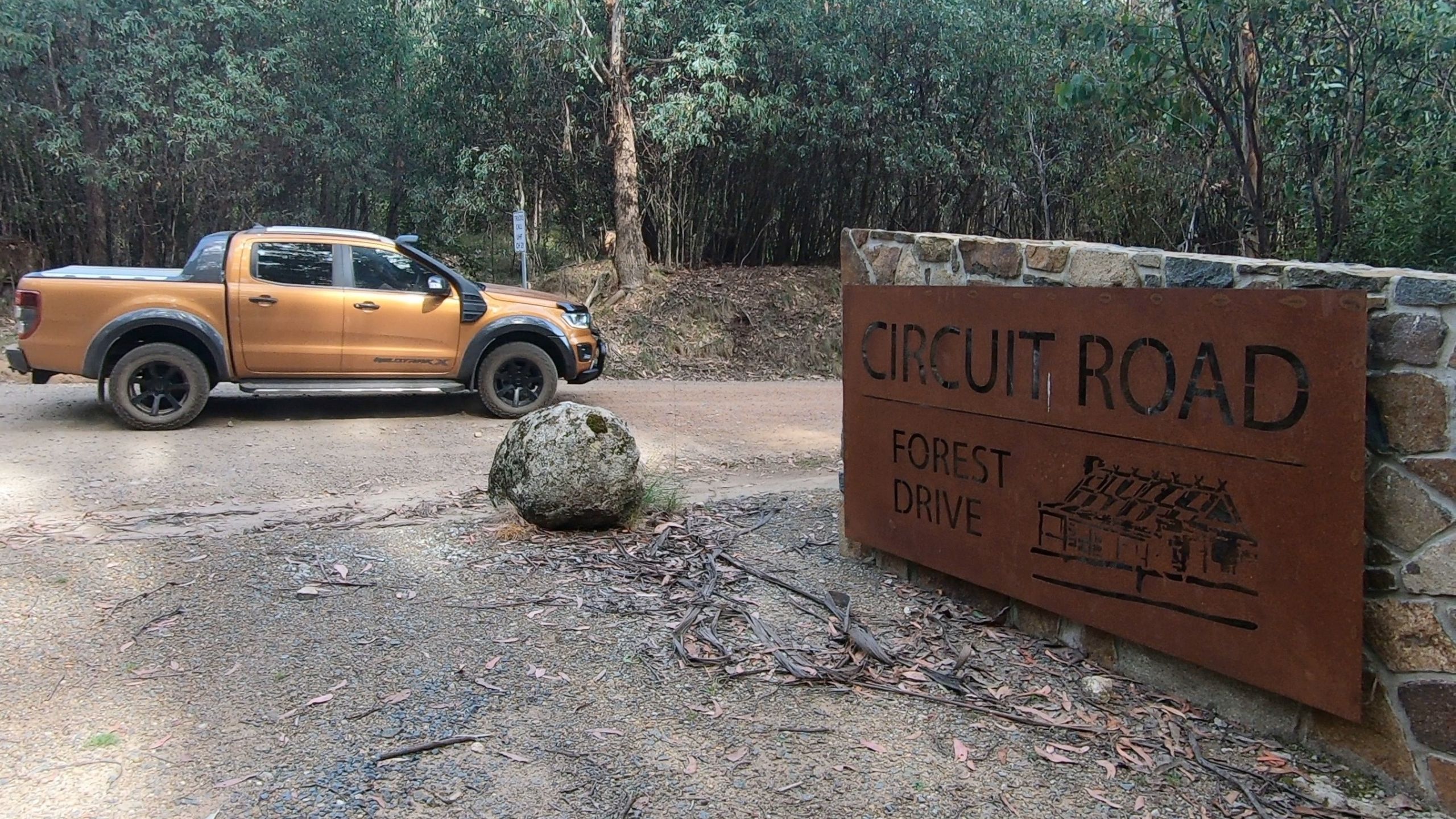 Ford Ranger Wildtrack X parked on Circuit Road near a Forest Drive sign, ready for off-road adventure in the Victorian Alps.