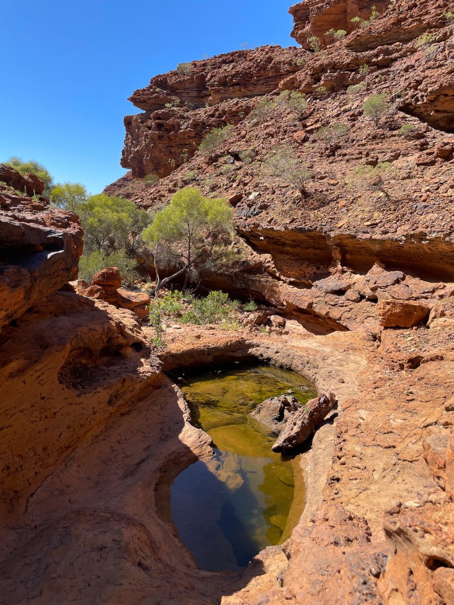 Figure 8 shaped waterhole along the Drapers Gorge Walk. Carved by water showcasing the rugged landscapes of Kennedy Range Western Australia.